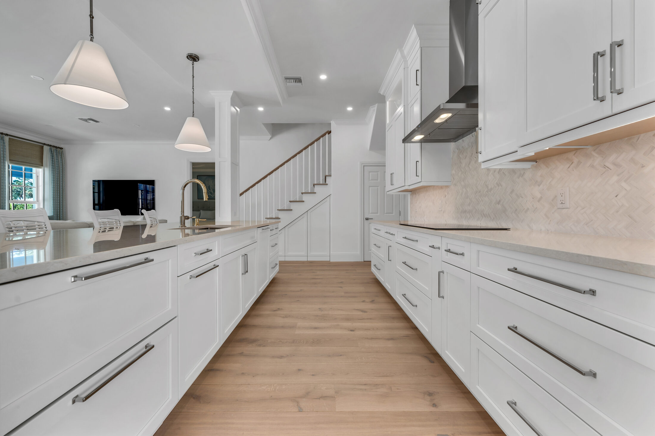 A long cabinet run ProFloors installed on First Avenue, Old Naples — scribed in place along the floor and ceiling lines