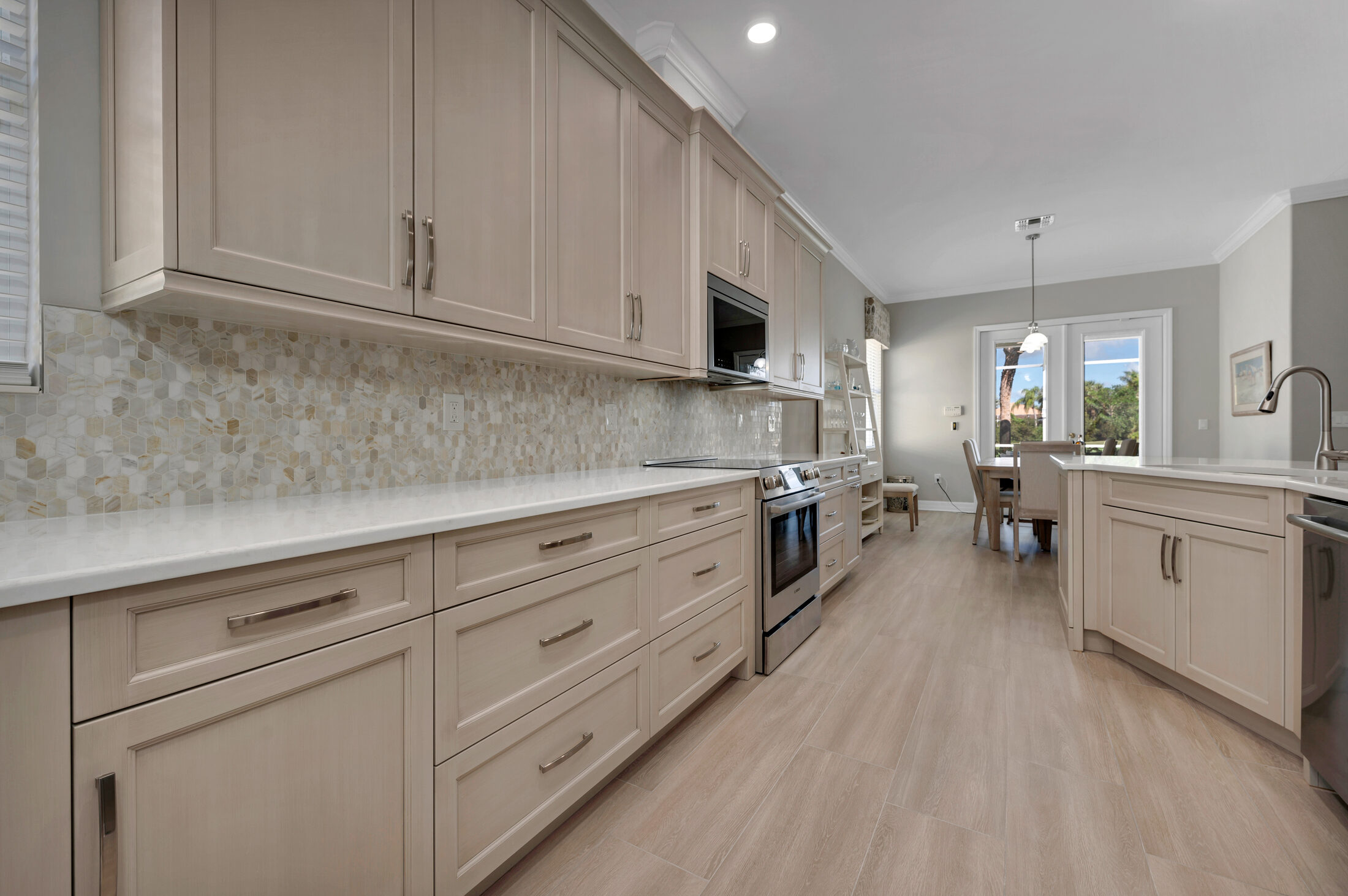 Finished home in Grand Cypress, Naples. Warm hardwood across the open plan.