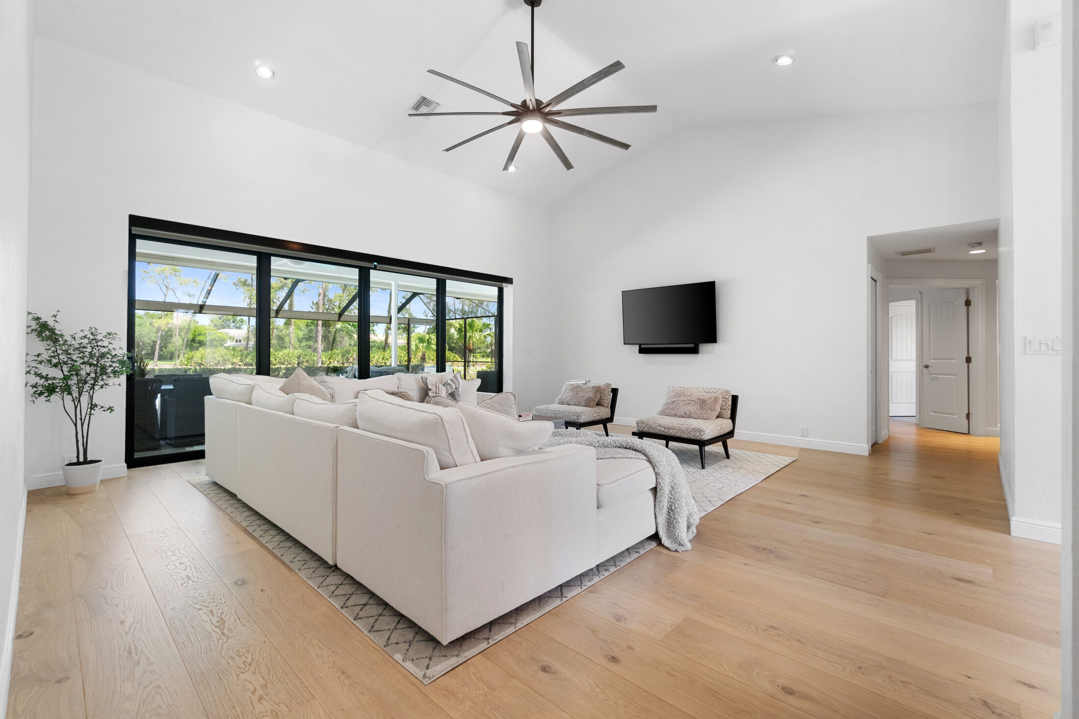 Finished home in Quail Creek, Naples. Wide-plank hardwood under beamed ceilings.