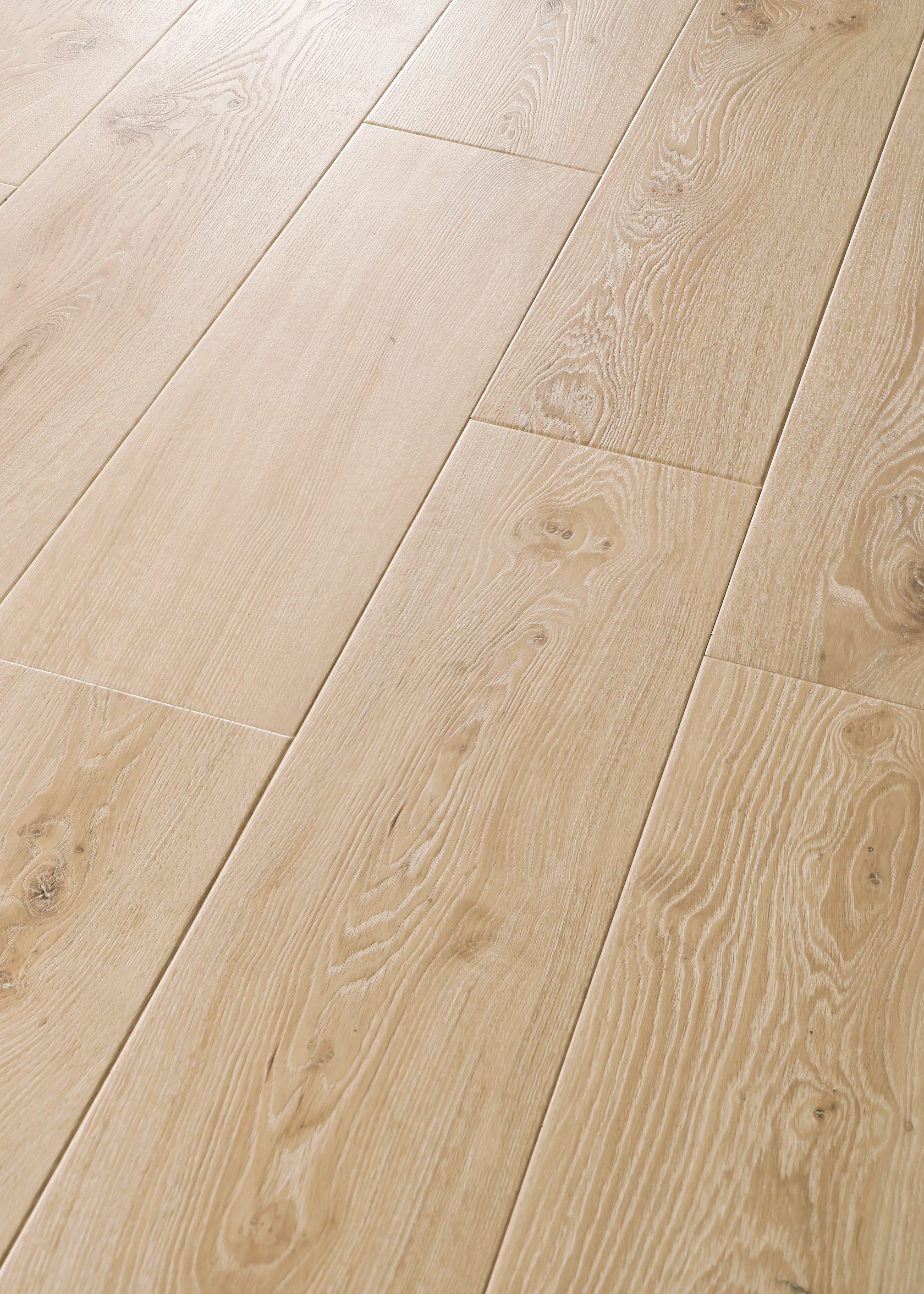 Light oak-look luxury vinyl wide plank, close detail of the grain