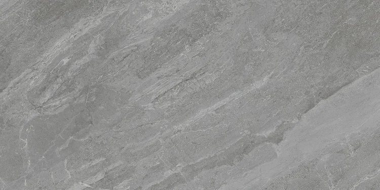 Grey stone-look porcelain, close enough to read the movement in the surface
