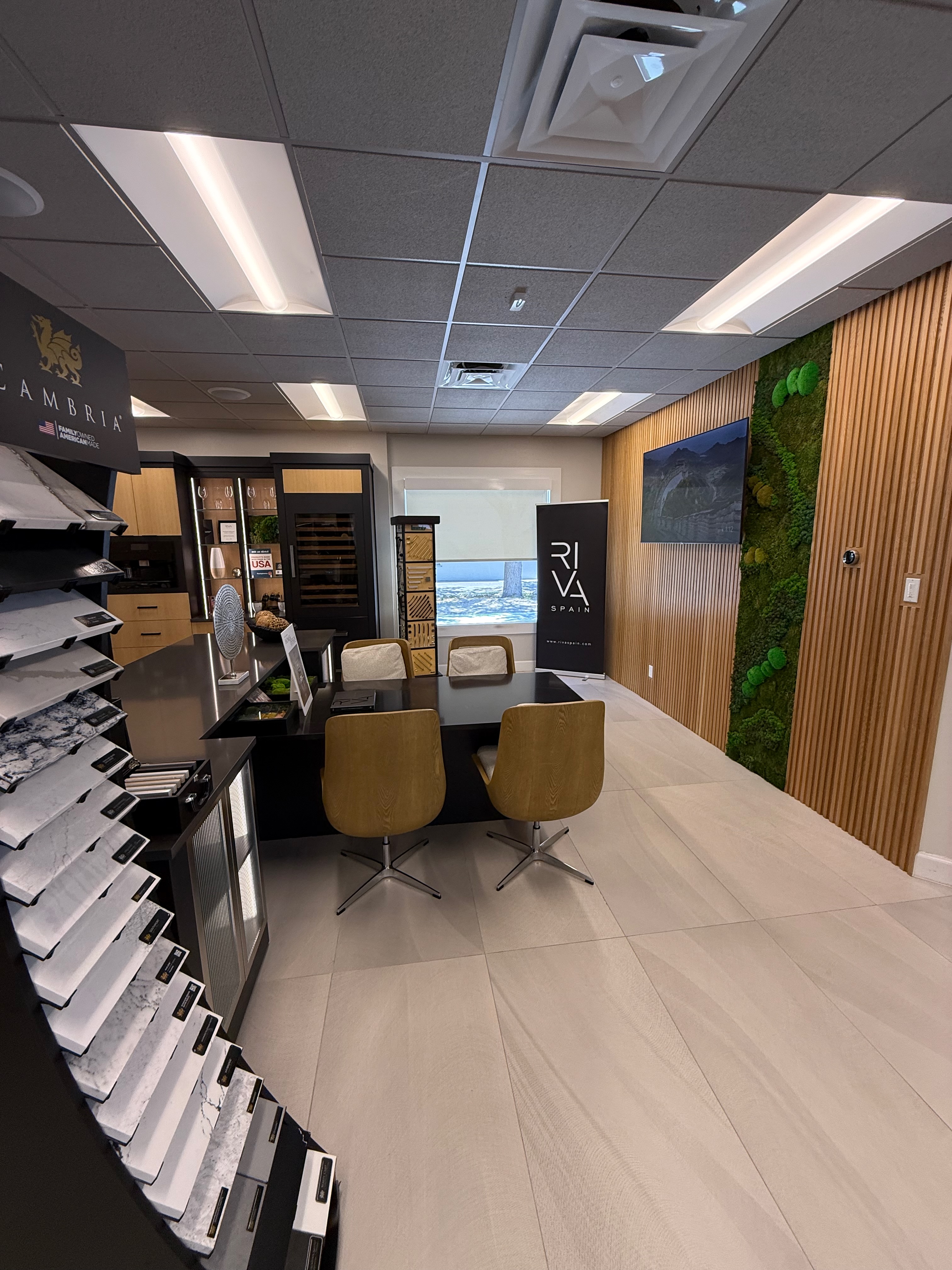 A Cambria quartz selection wall in the ProFloorz Naples showroom, where door finishes and tops are paired together